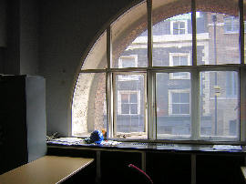 Curved secondary glazing