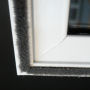 Woolpile on a fixed unit of secondary glazing.
